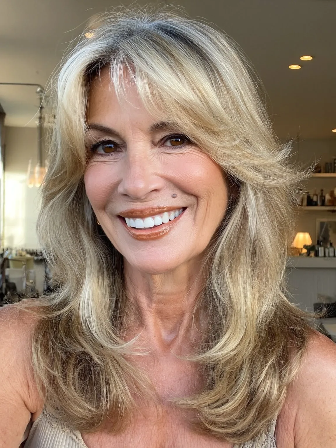 Sun-Kissed Blonde Feathered Layers with Curtain Bangs